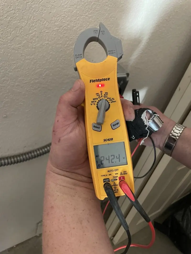 Voltage testing with clamp meter during Generator Installation in Highland Heights